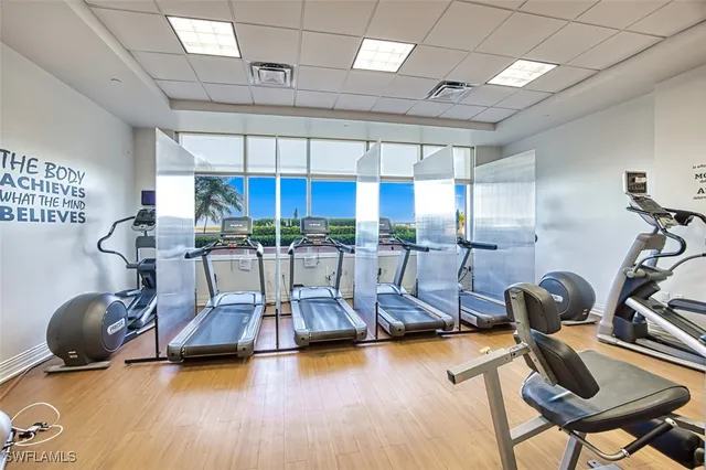a room with gym equipment and a table