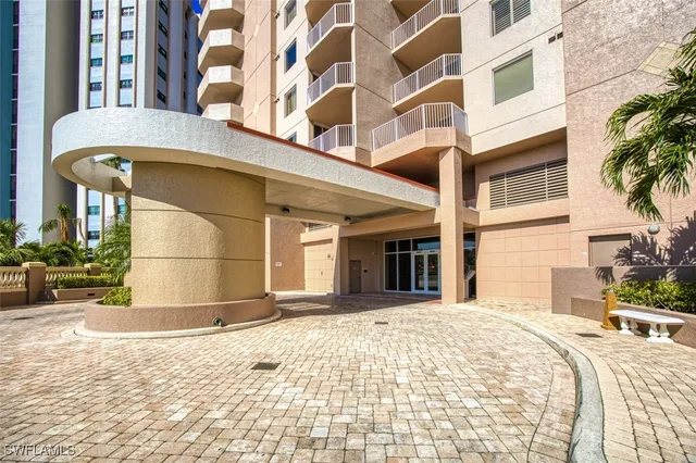 a view of a building with a umbrellas