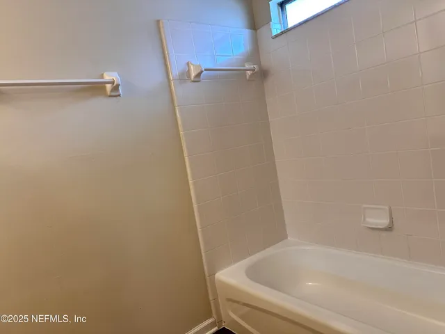 a bathroom with a bathtub