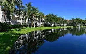 a view of lake with a house in the background