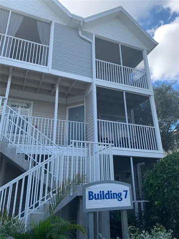 a view of a house with porch and wooden floor