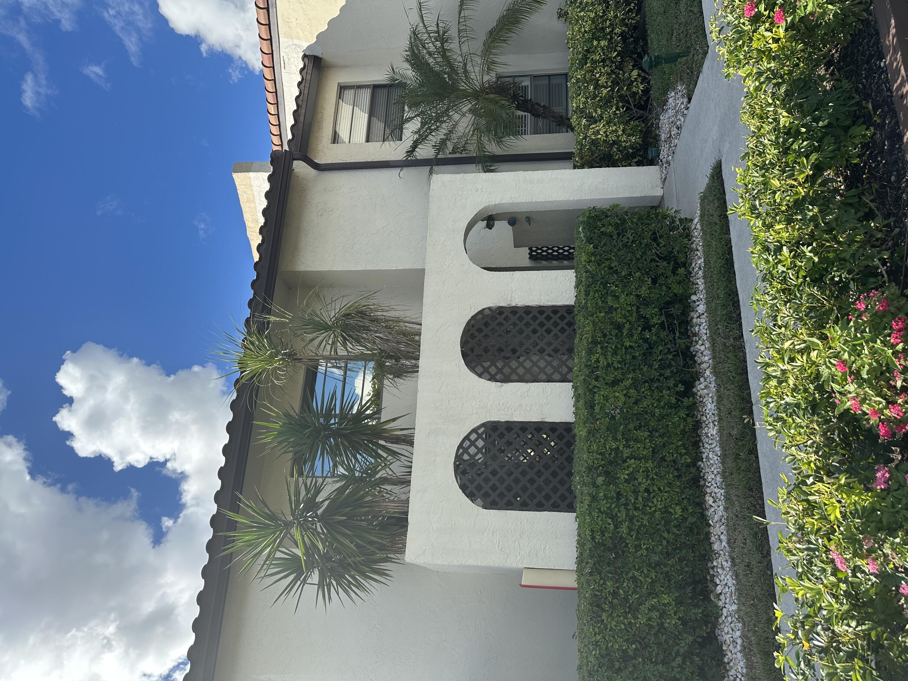 21863 Arriba Real, Unit 8G Boca Raton, FL 33433 - Photo 2 of 36 FRONT