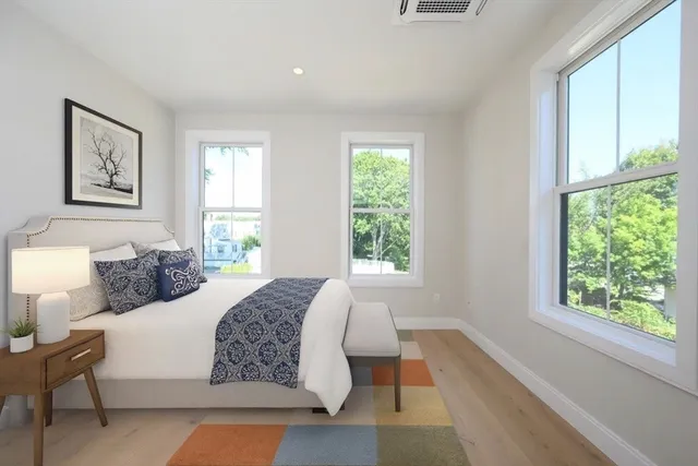 a bathroom with a sink a bathtub and window