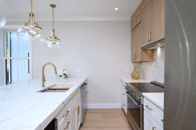 a kitchen with a sink and window