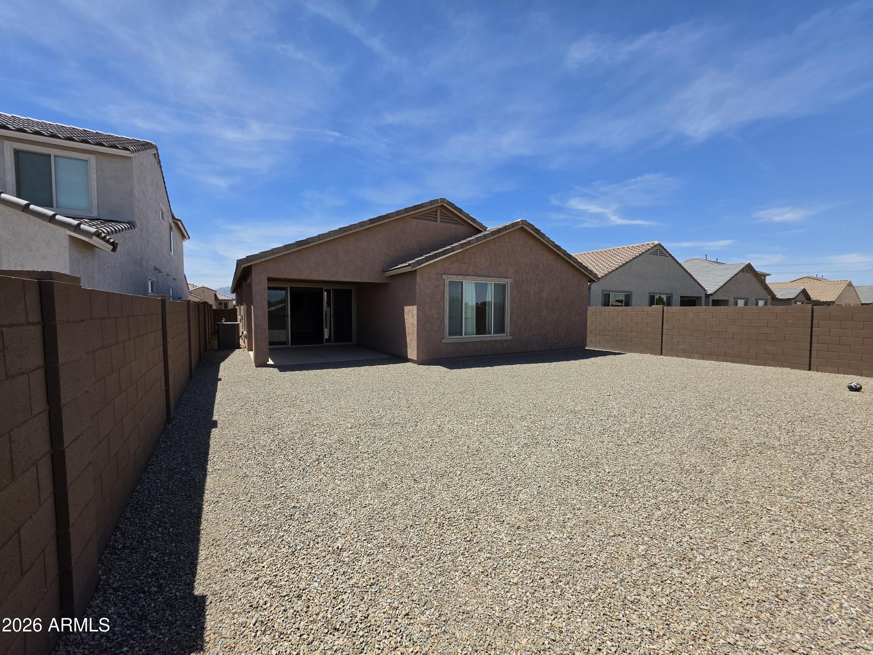 7128 West Coles Road Laveen, AZ 85339 - Photo 36 of 38 a front view of a house with a yard
