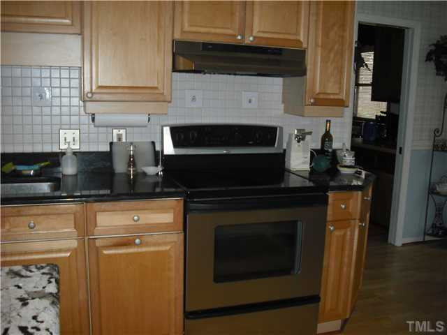 3316 Manor Ridge Drive Raleigh, NC 27603 - Photo 5 of 15 Another view of the kitchen including the smooth top range Kitchen