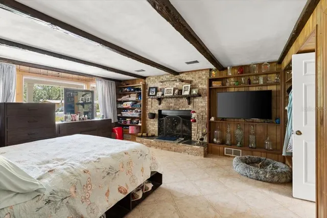 a bed room with a bed and a television