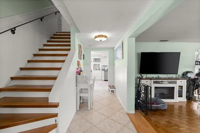 a view of entryway livingroom and hall with wooden floor