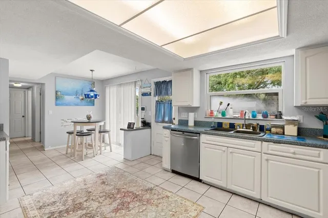 a kitchen with stainless steel appliances granite countertop a sink and cabinets