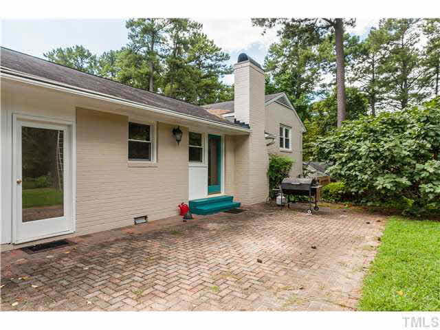 912 Macon Place Raleigh, NC 27609 - Photo 11 of 14 a backyard of a house with table and chairs