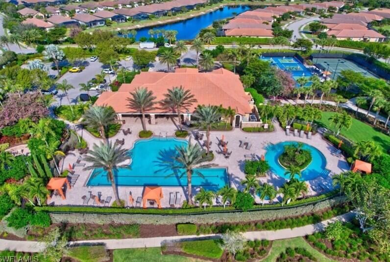8581 Maggiore Court Naples, FL 34114 - Photo 25 of 33 an aerial view of residential houses with outdoor space and swimming pool
