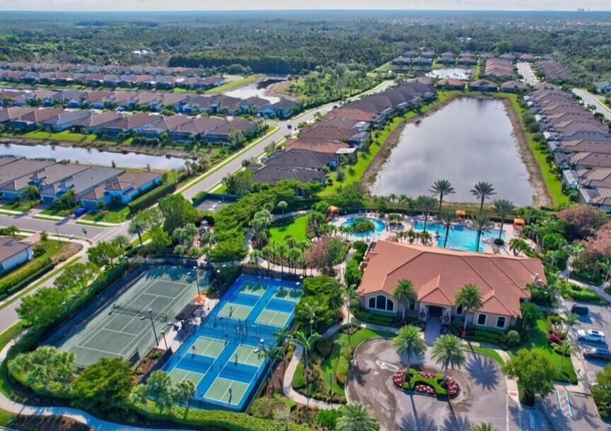 8581 Maggiore Court Naples, FL 34114 - Photo 27 of 33 an aerial view of residential houses with outdoor space