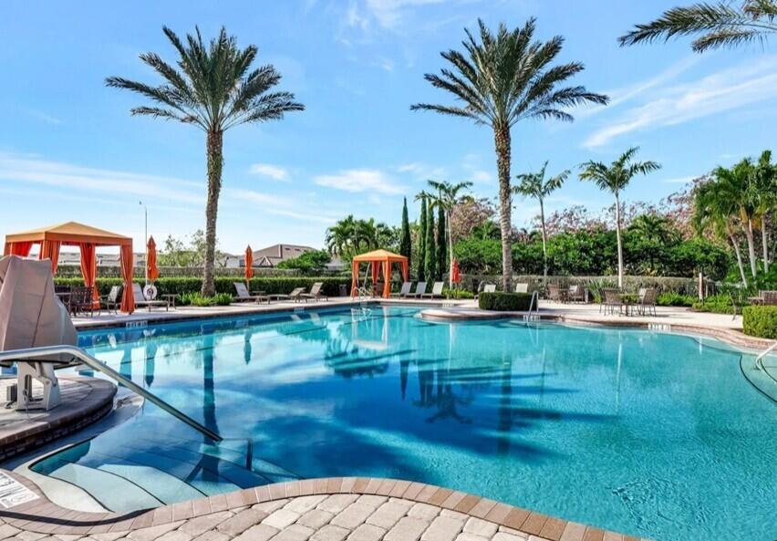 8581 Maggiore Court Naples, FL 34114 - Photo 28 of 33 a view of a swimming pool with a patio and a garden