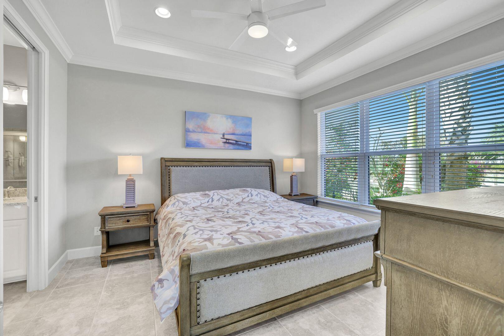 8581 Maggiore Court Naples, FL 34114 - Photo 4 of 33 a bedroom with a bed and a large window