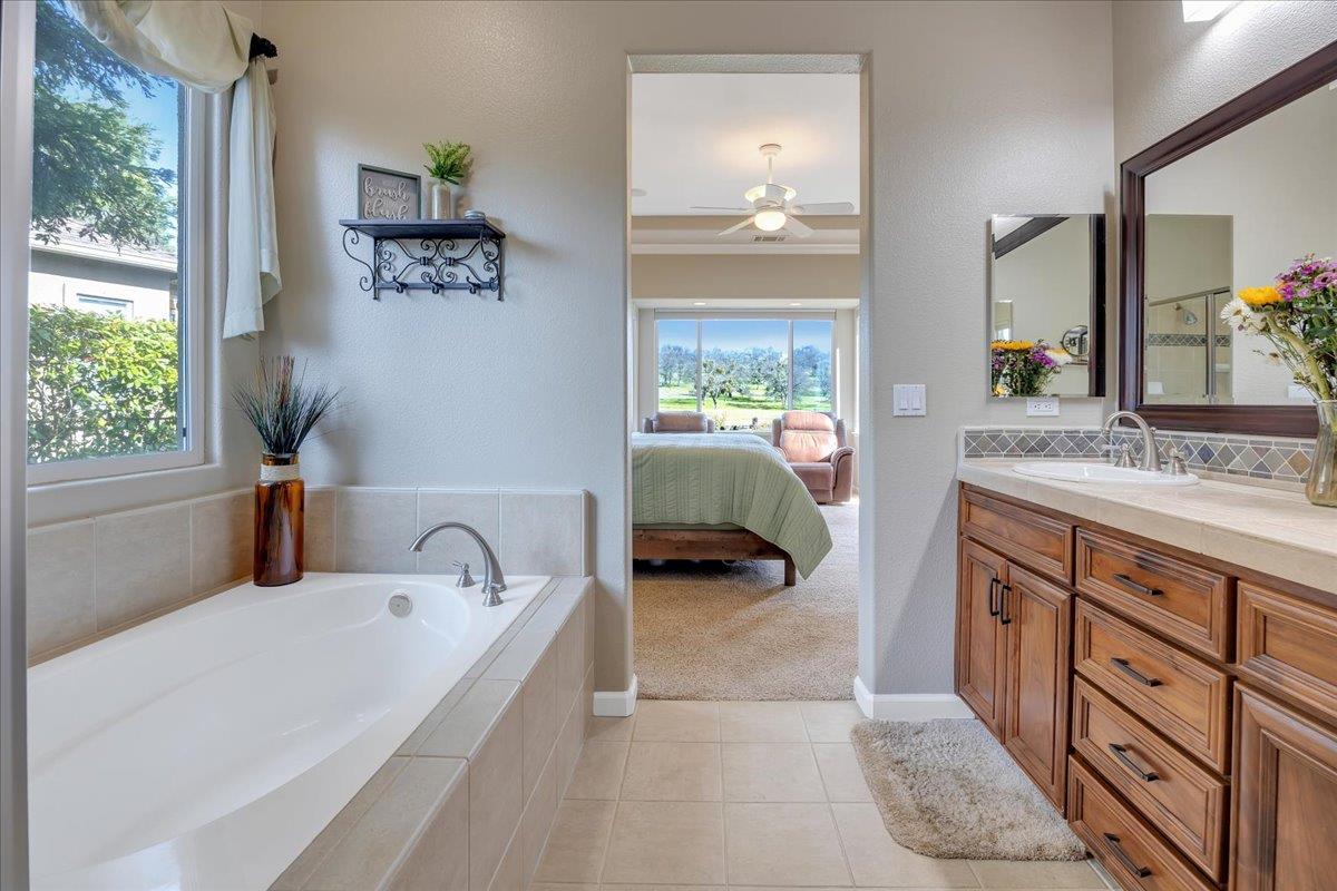300 Rock Ridge Lane Copperopolis, CA 95228 - Photo 68 of 99 Soaking tub, lovely cabinetry and updated tilework.