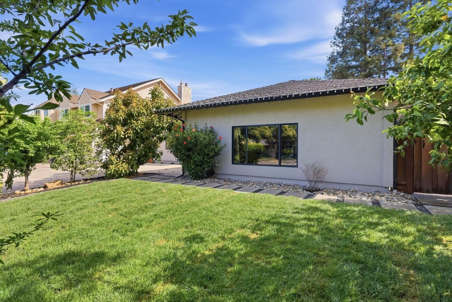 845 Pollard Road Los Gatos, CA 95032 - Photo 3 of 47 a front view of a house with garden
