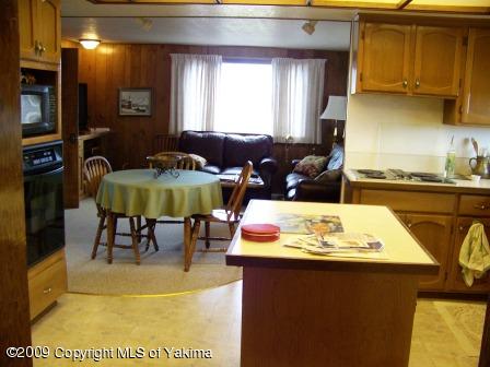 168002 McCreadie Road Grandview, WA 98930 - Photo 16 of 34 a view of kitchen with dining table and chairs
