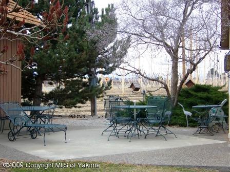168002 McCreadie Road Grandview, WA 98930 - Photo 26 of 34 a view of a table and chairs in a patio
