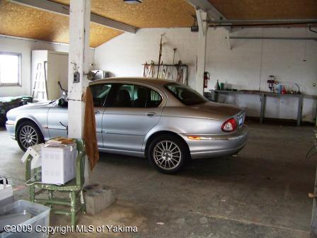 168002 McCreadie Road Grandview, WA 98930 - Photo 30 of 34 a car parked in a garage