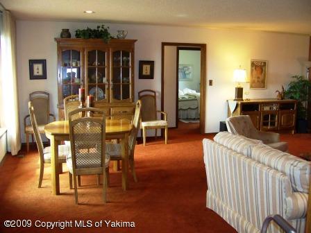 168002 McCreadie Road Grandview, WA 98930 - Photo 10 of 34 a living room with furniture a wooden floor and a dining table
