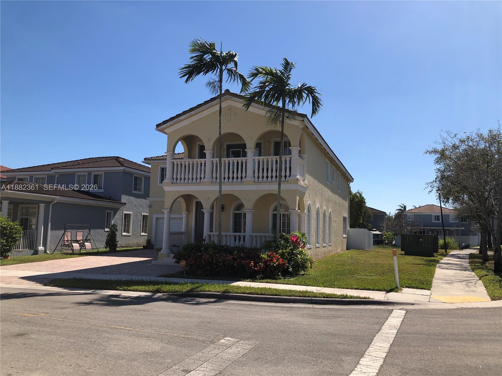 13986 Southwest 276th Way Homestead, FL 33032 - Photo 3 of 32 a front view of a house with a yard