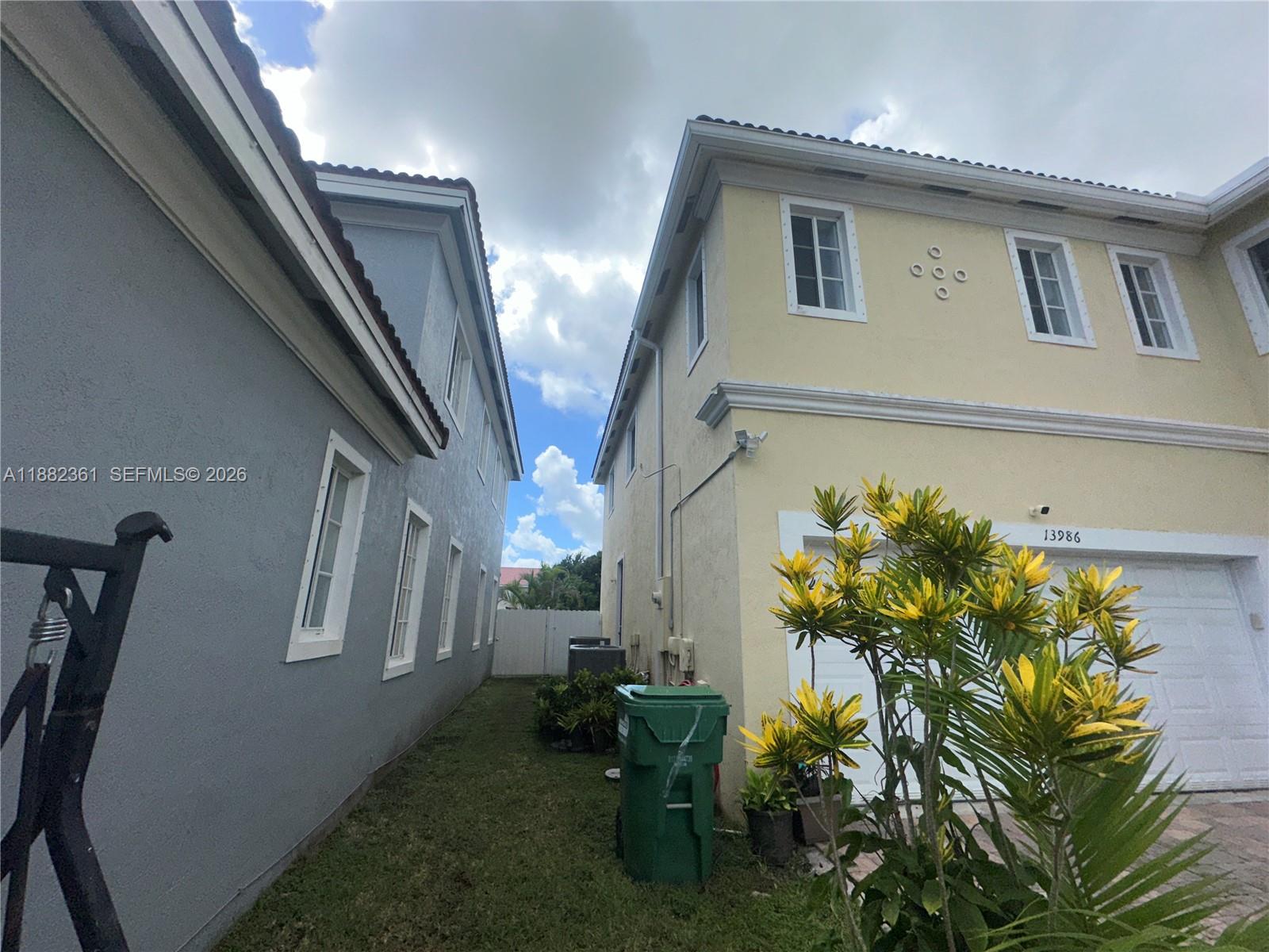 13986 Southwest 276th Way Homestead, FL 33032 - Photo 32 of 32 a view of entryway with window and flower pot