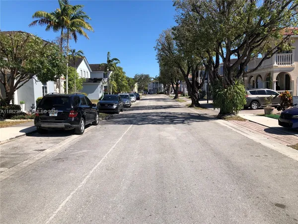 a view of street with parked cars