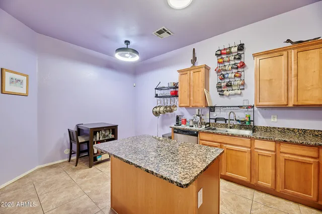 a kitchen with sink cabinets and window