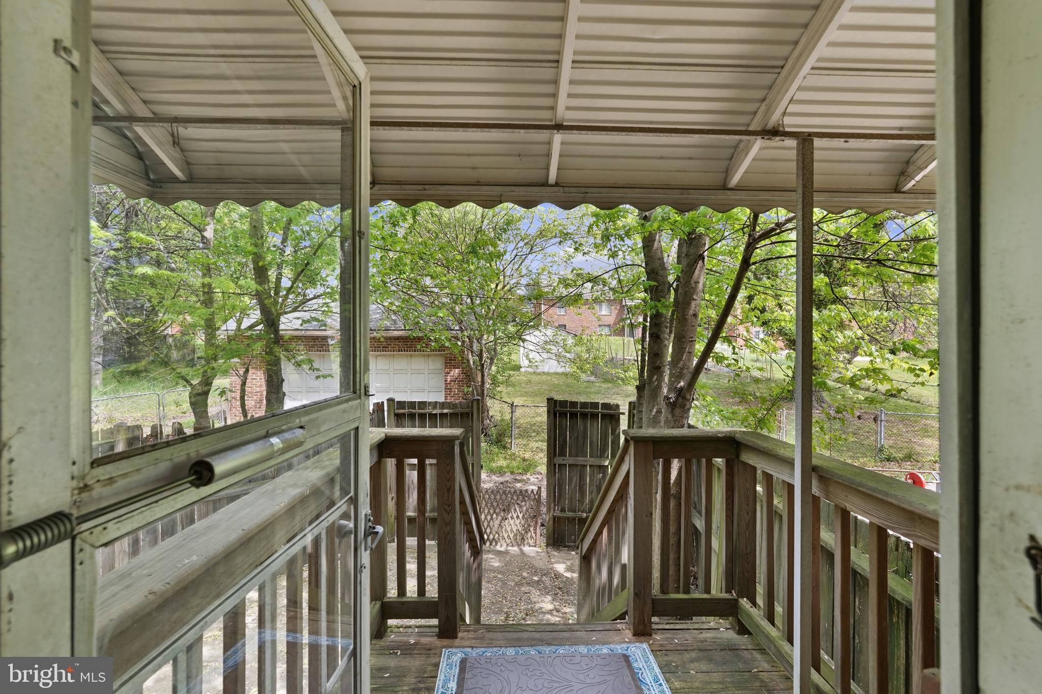 3612 Evergreen Avenue Baltimore, MD 21206 - Photo 30 of 44 back porch leading to fenced back yard