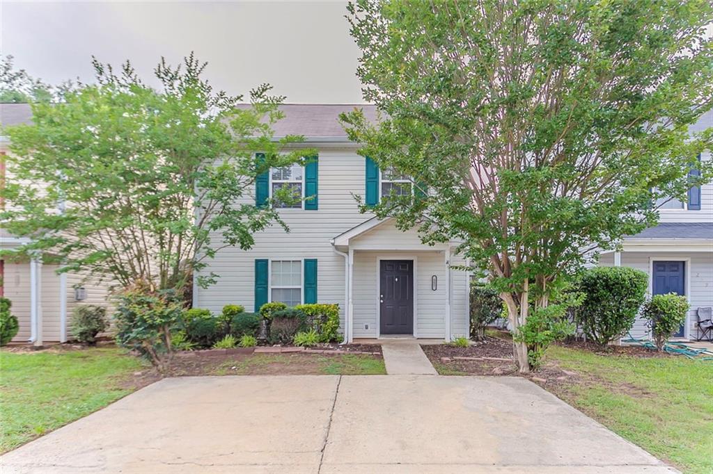 257 Turnstone Road Stockbridge, GA 30281 - Photo 1 of 1 a front view of a house with garden