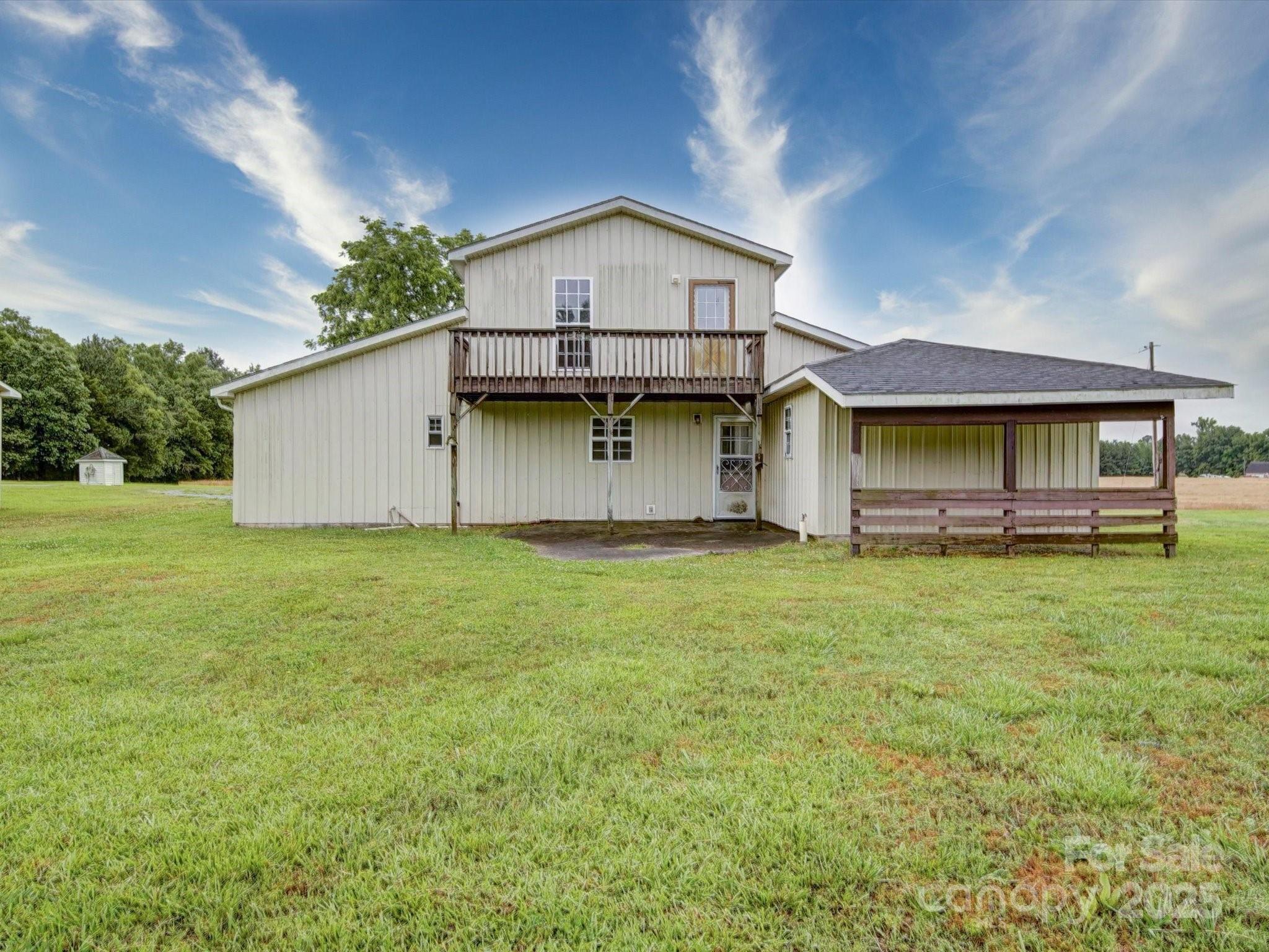 4115 Jenkins Road Marshville, NC 28103 - Photo 13 of 39 a front view of a house with a garden and yard