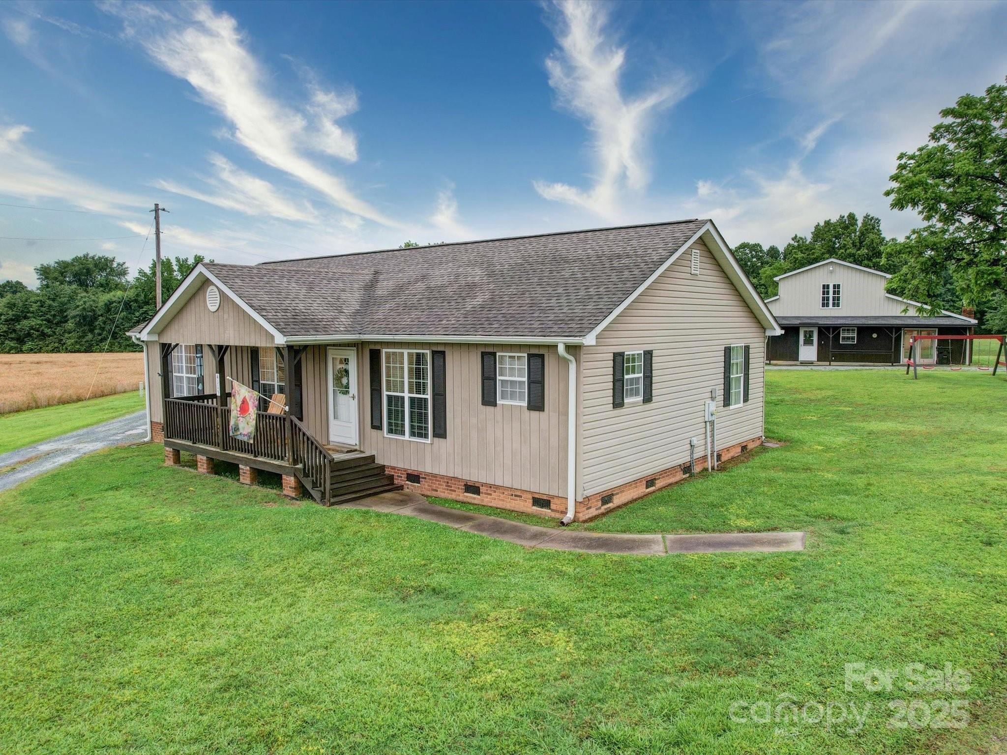4115 Jenkins Road Marshville, NC 28103 - Photo 2 of 39 a view of a house with a yard and sitting area