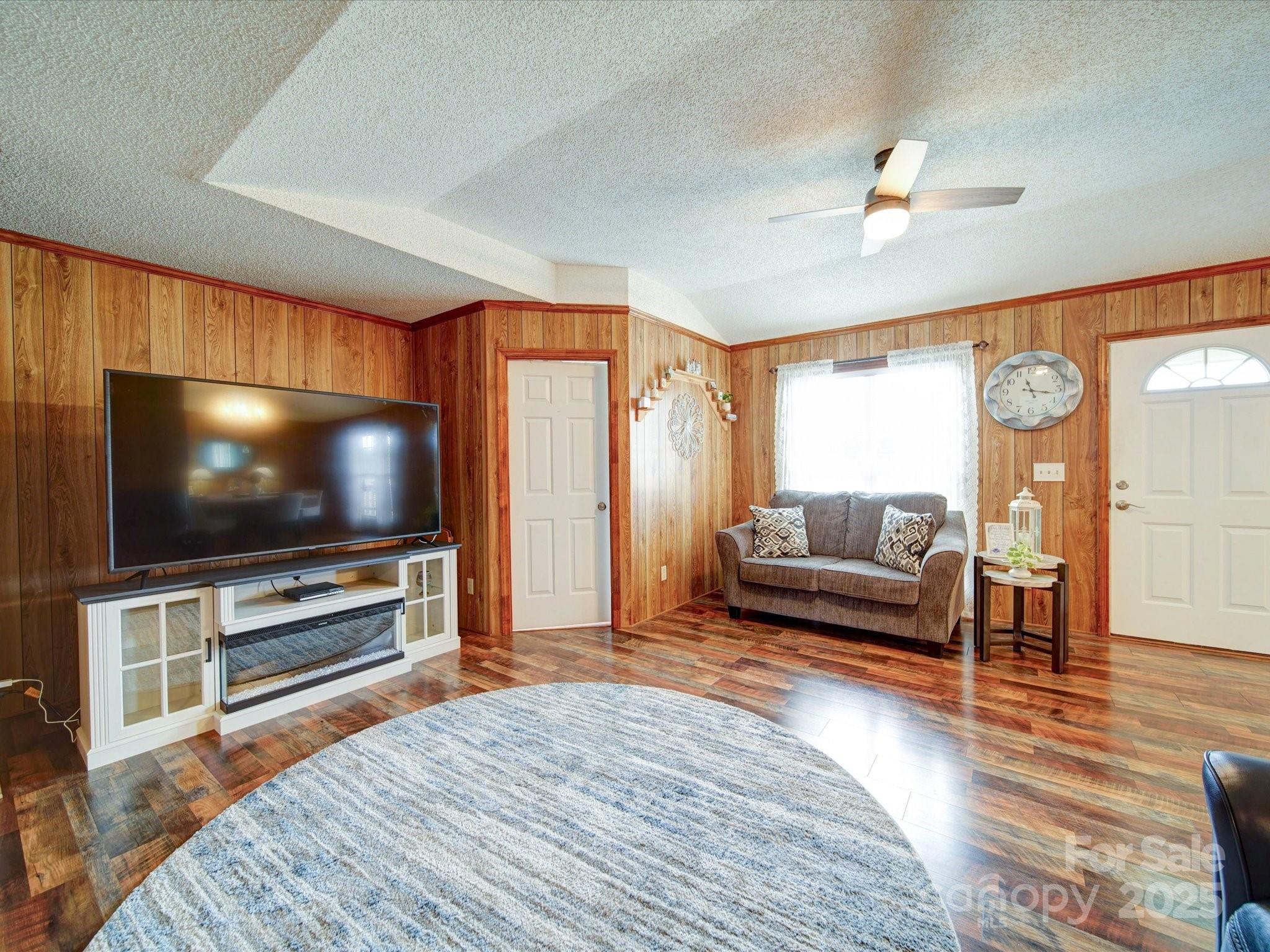 4115 Jenkins Road Marshville, NC 28103 - Photo 30 of 39 a living room with furniture and a flat screen tv