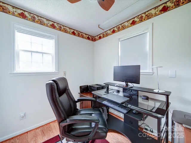 a work room with furniture and a window