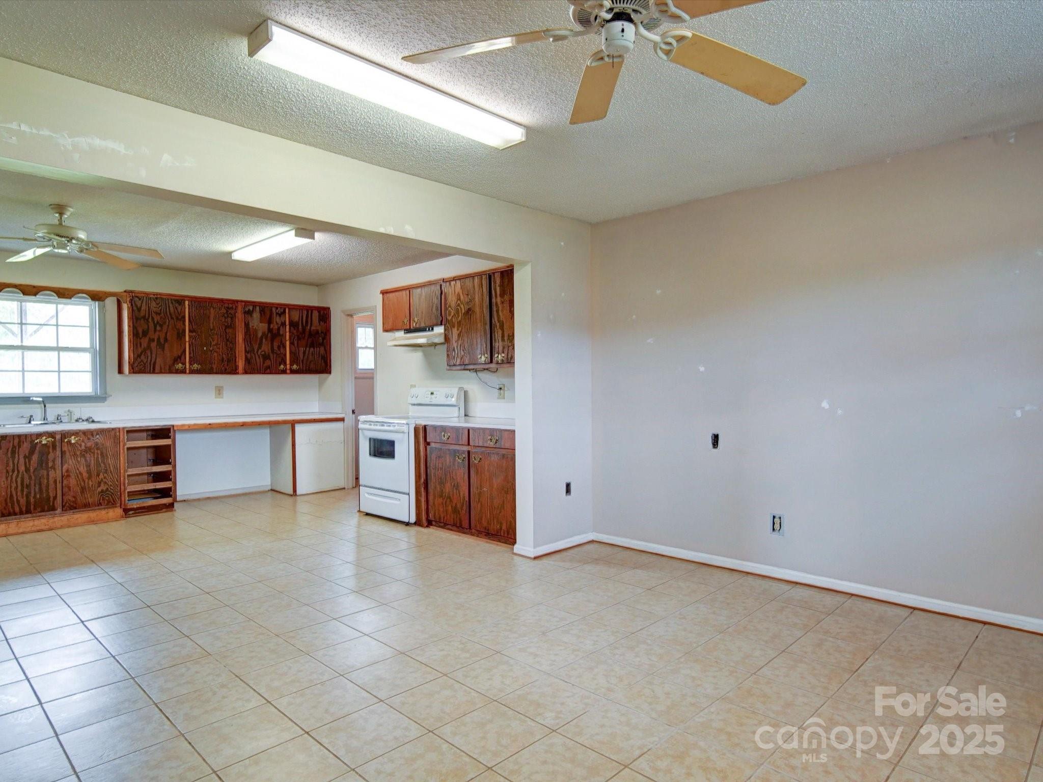 4115 Jenkins Road Marshville, NC 28103 - Photo 34 of 39 a large white kitchen with a sink and cabinets