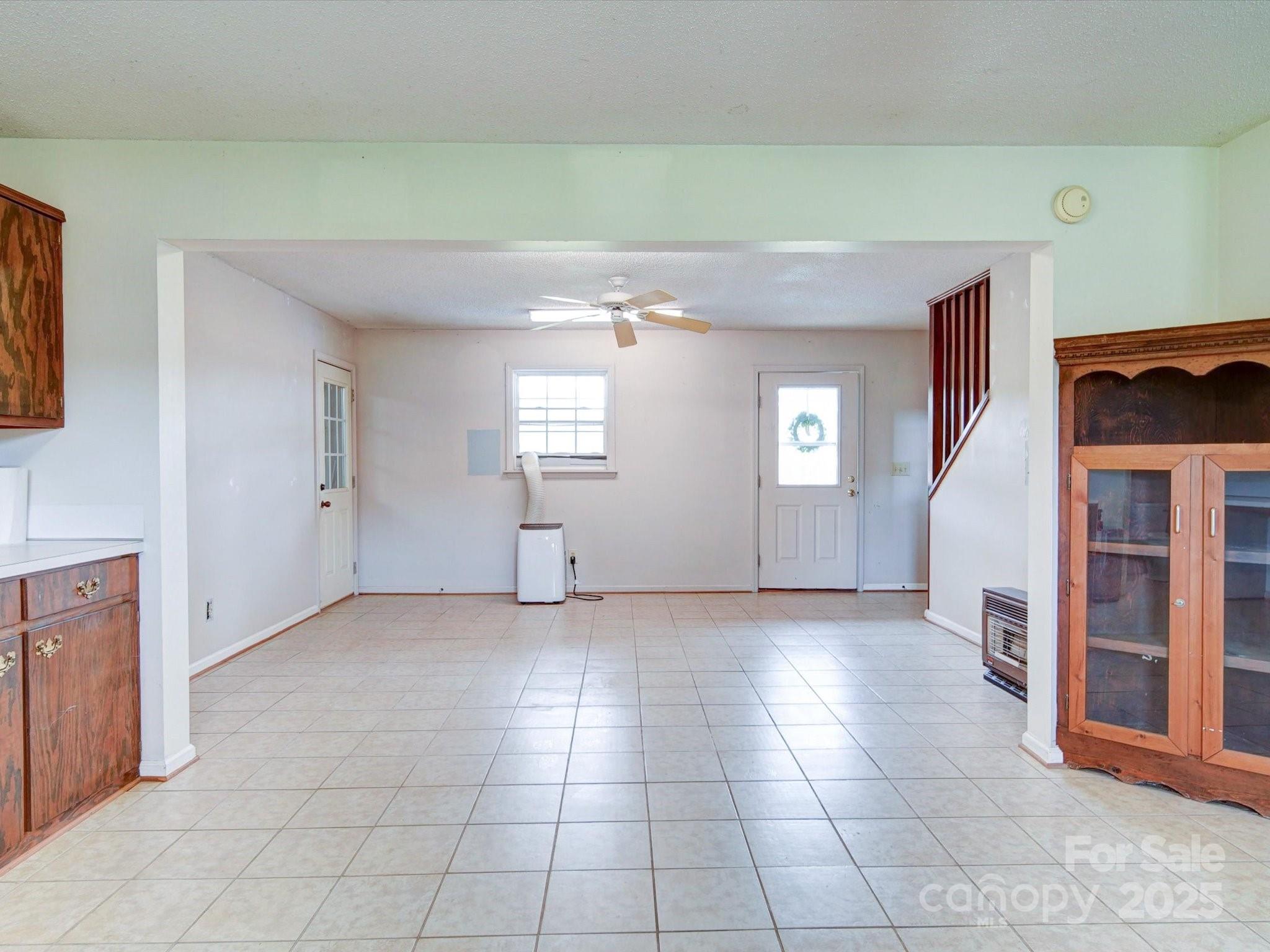 4115 Jenkins Road Marshville, NC 28103 - Photo 35 of 39 a view of an empty room with window and stairs