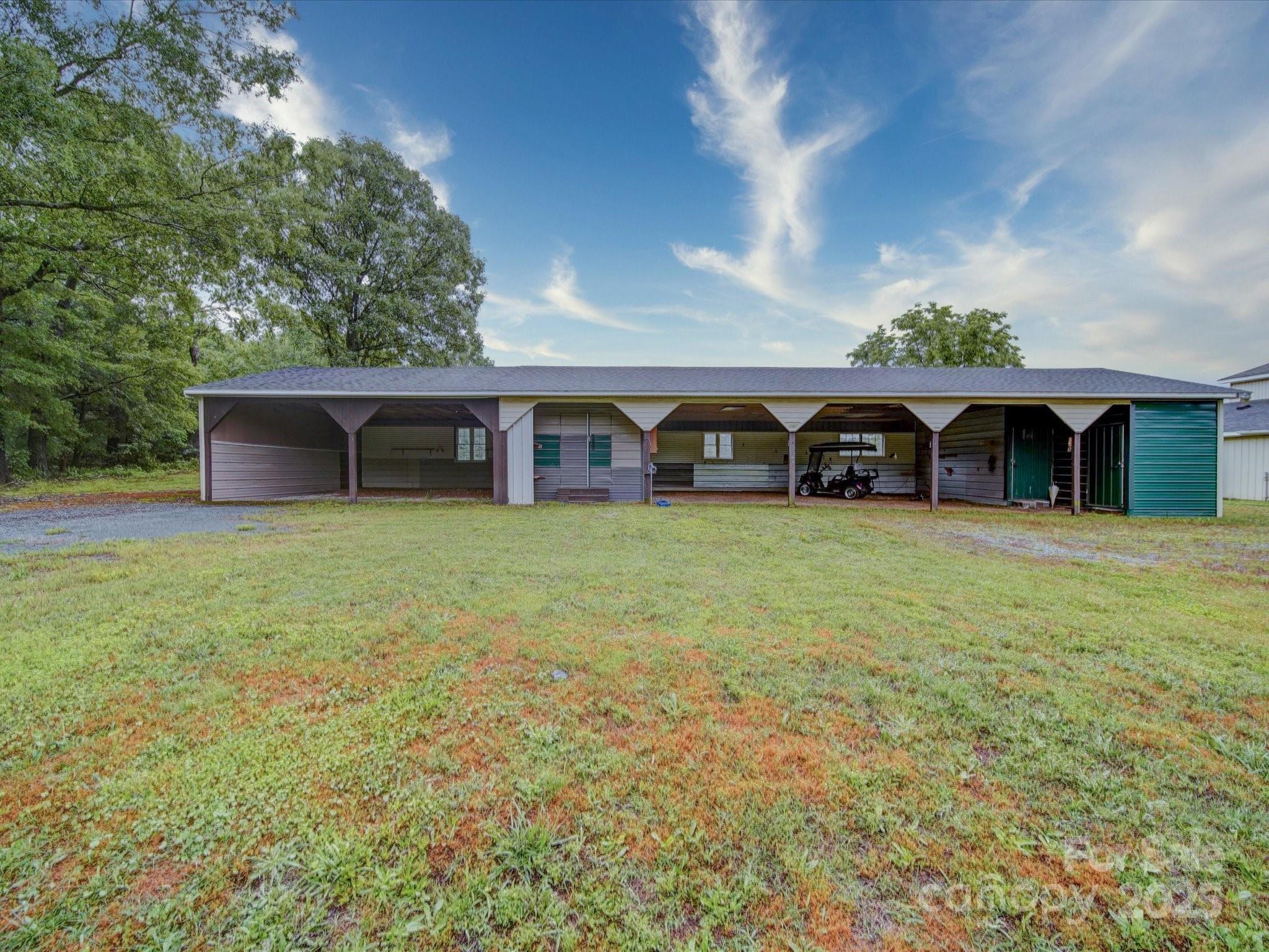 4115 Jenkins Road Marshville, NC 28103 - Photo 4 of 39 an outdoor view of house with yard and outdoor seating