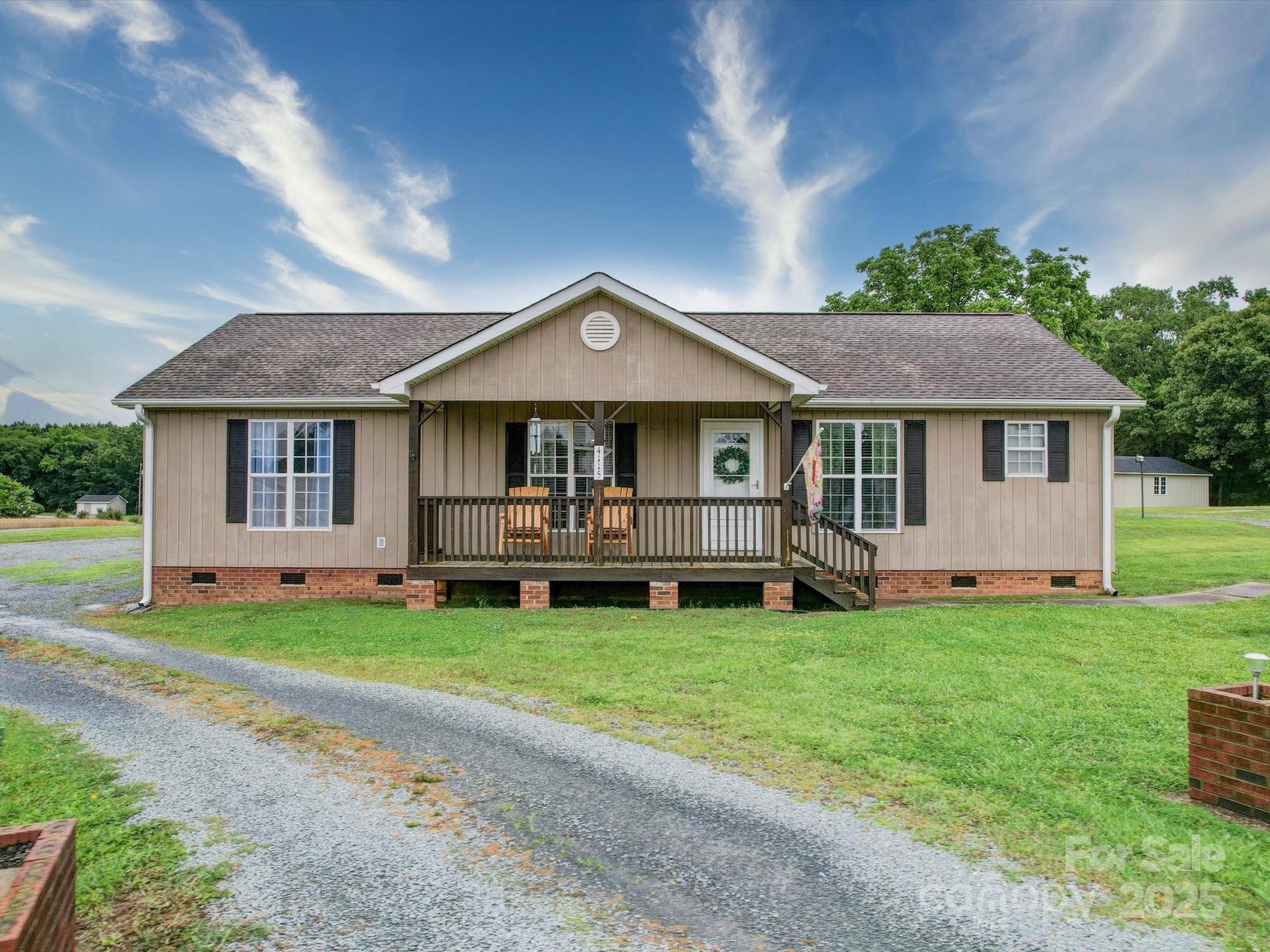4115 Jenkins Road Marshville, NC 28103 - Photo 8 of 39 a front view of a house with a garden