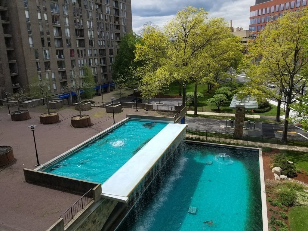 33 Pond Avenue, Unit 524 Brookline, MA 02445 - Photo 21 of 26 a view of a swimming pool with a patio