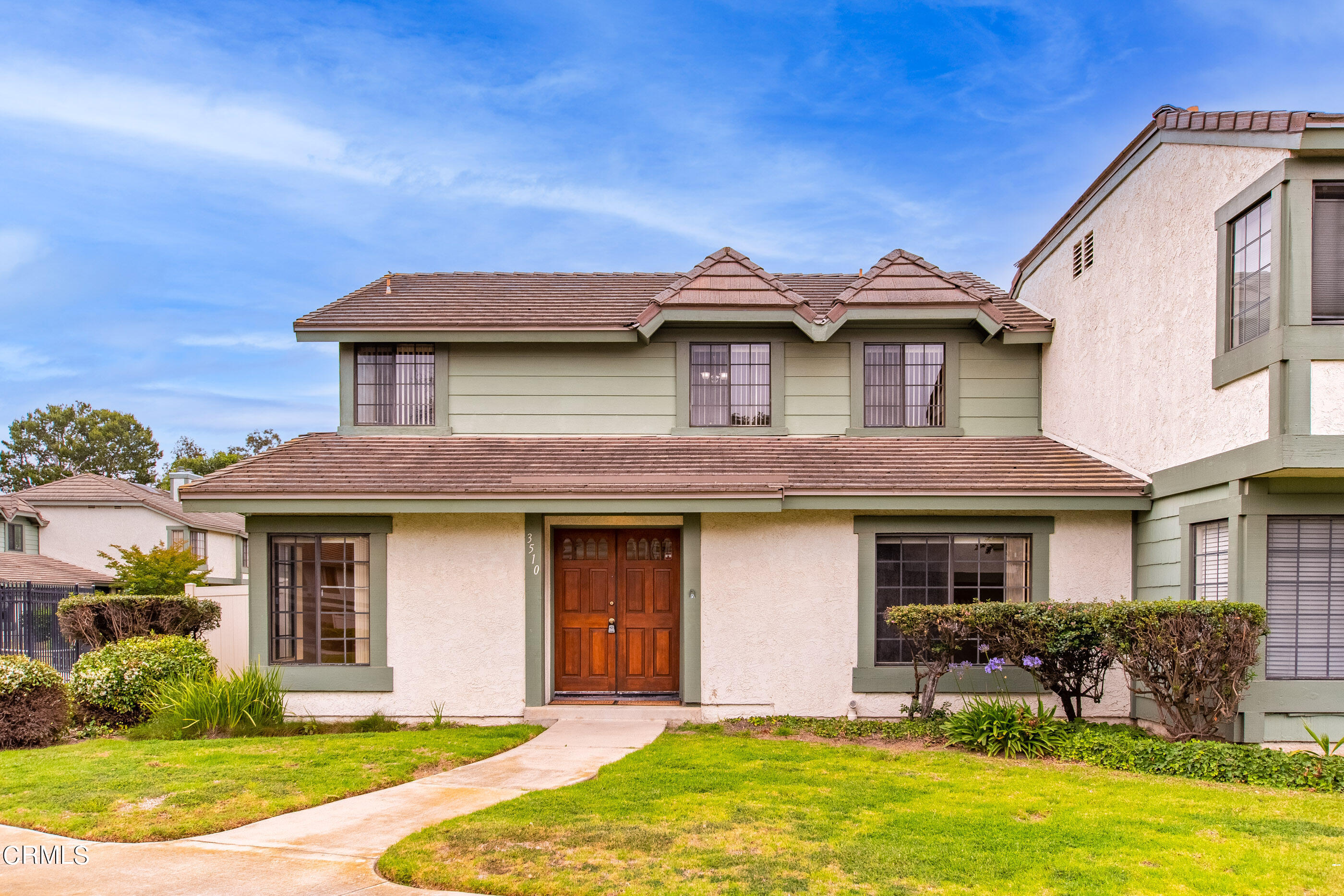 3510 Olds Road Oxnard, CA 93033 - Photo 1 of 36 a front view of a house with yard and porch
