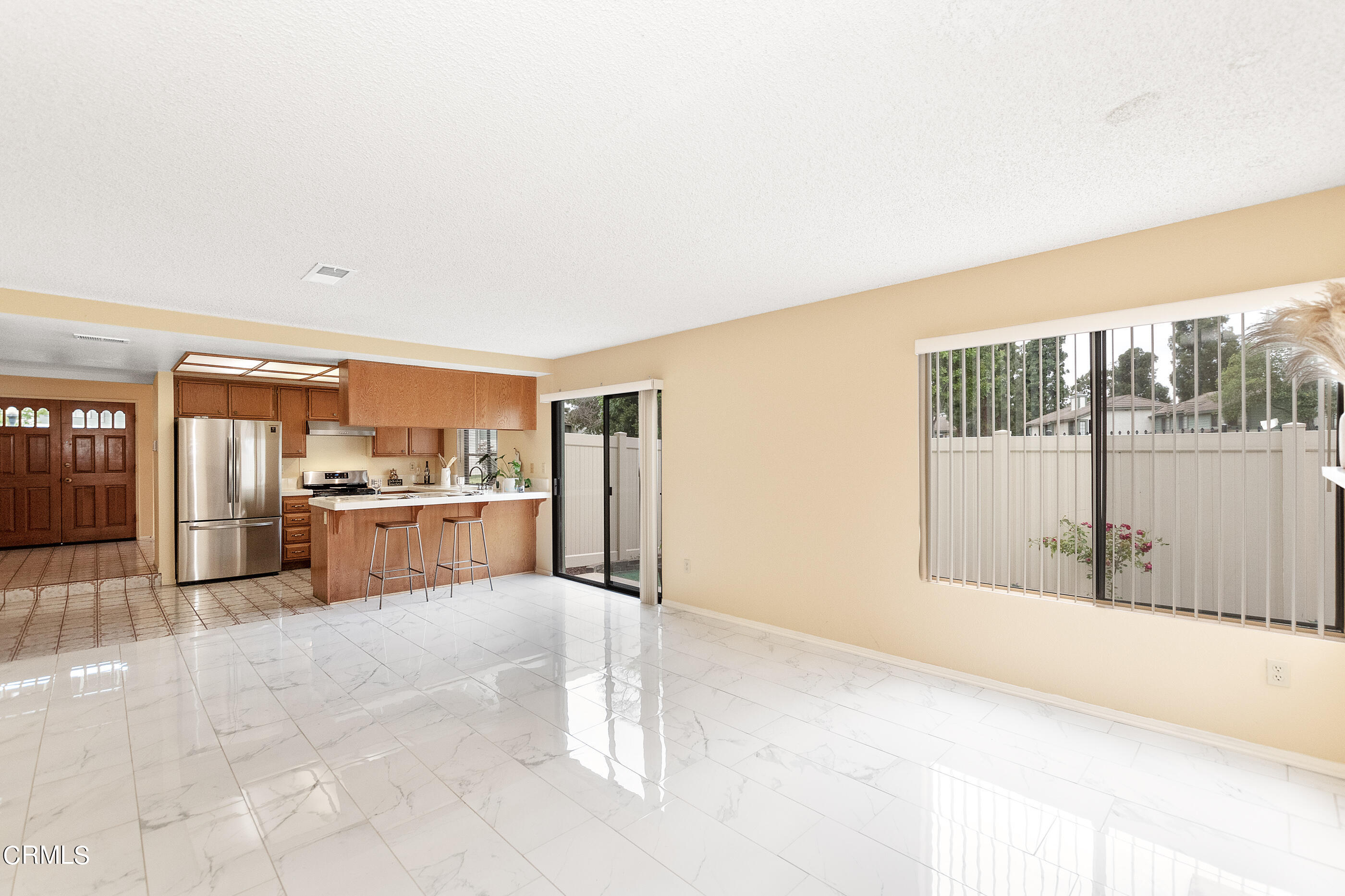 3510 Olds Road Oxnard, CA 93033 - Photo 13 of 36 a view of kitchen with refrigerator and cabinets