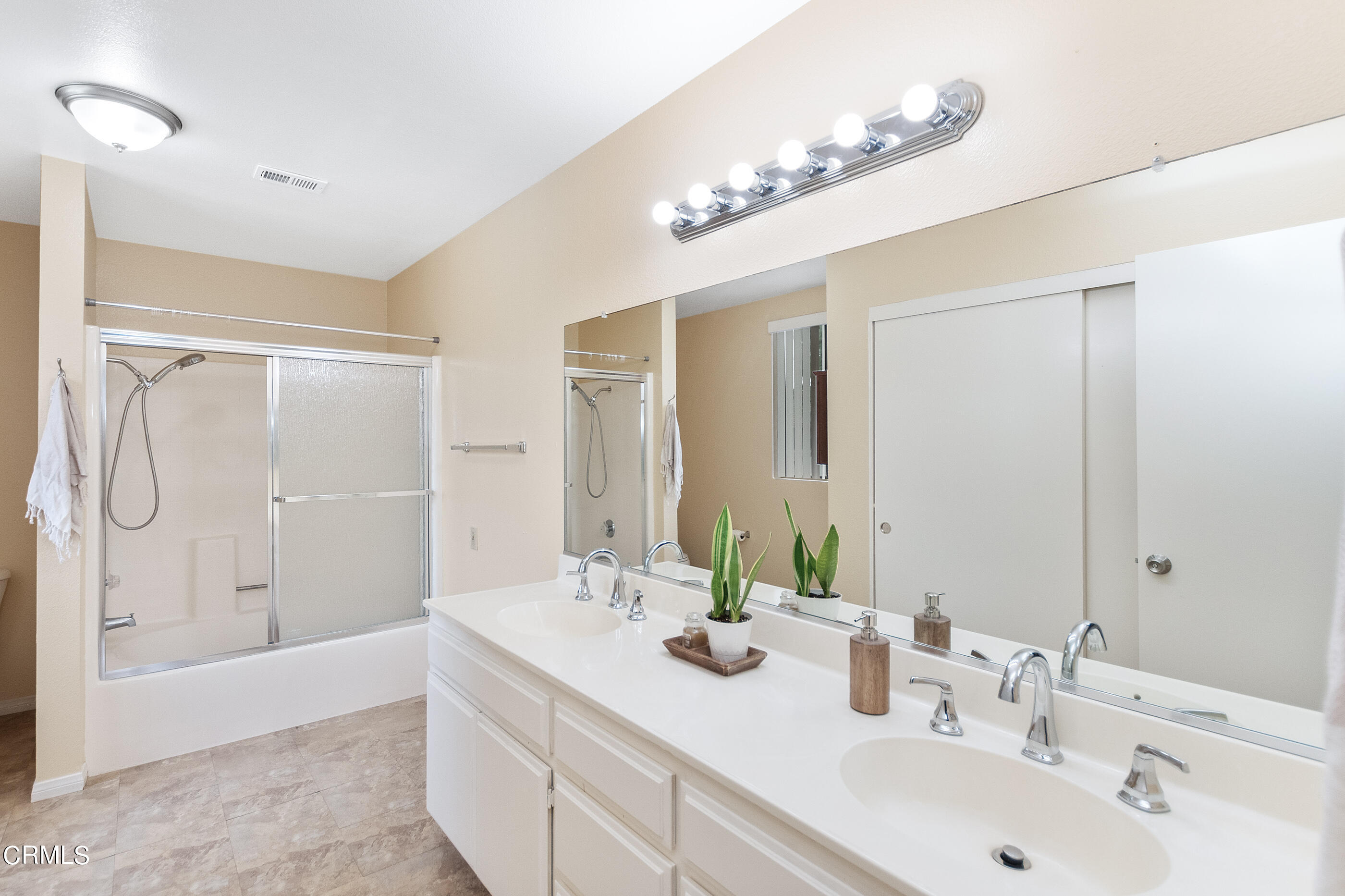 3510 Olds Road Oxnard, CA 93033 - Photo 22 of 36 a bathroom with a double vanity sink mirror double and shower