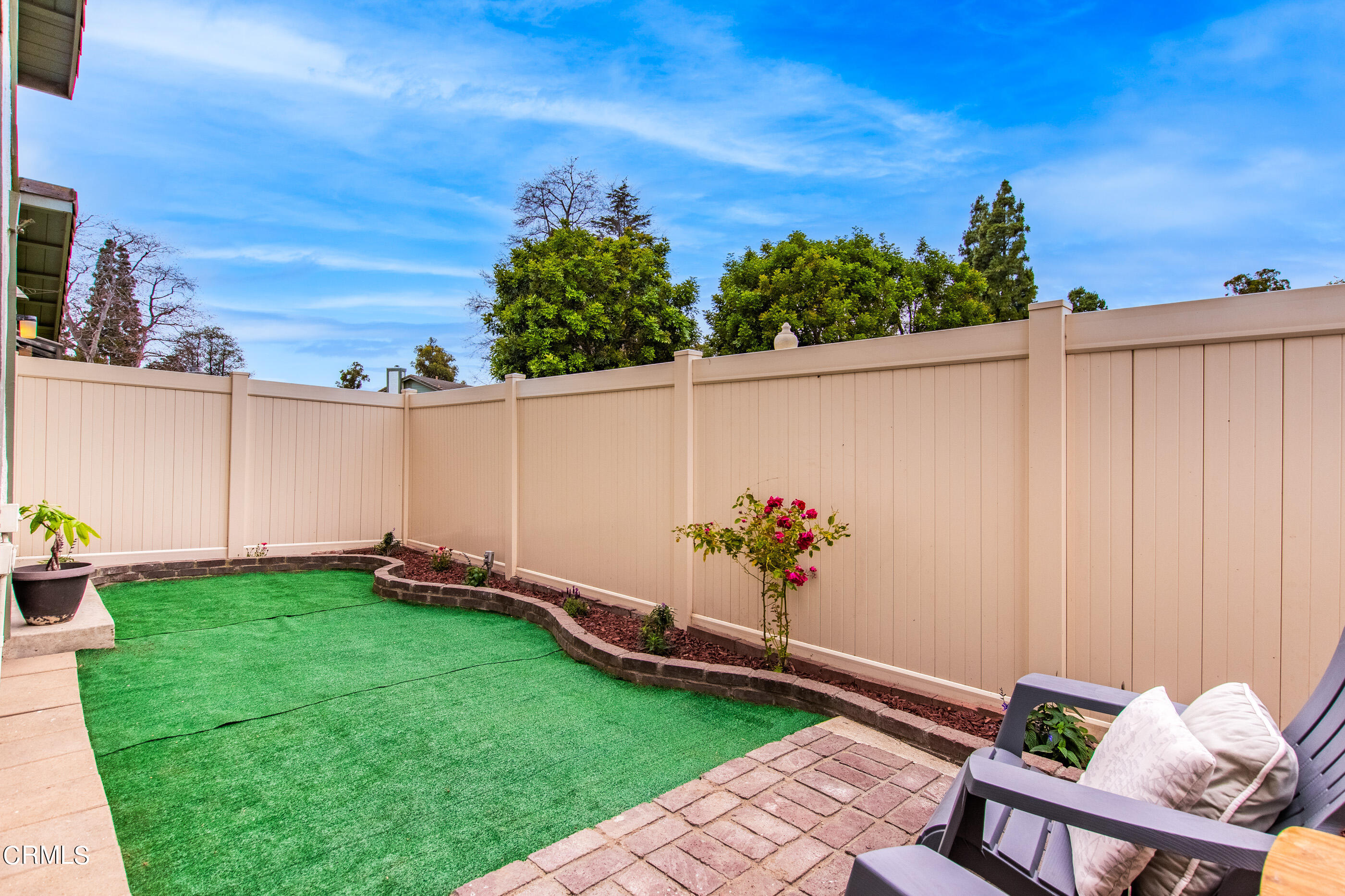 3510 Olds Road Oxnard, CA 93033 - Photo 32 of 36 a backyard with potted plants and a wooden bench