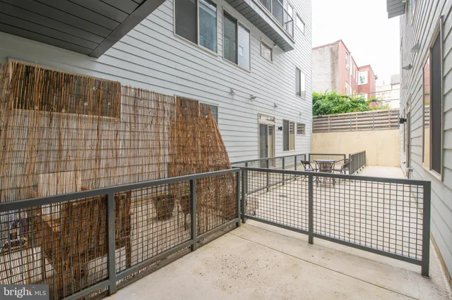 a view of a balcony with wooden floor