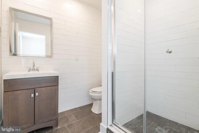 a bathroom with a sink toilet and vanity