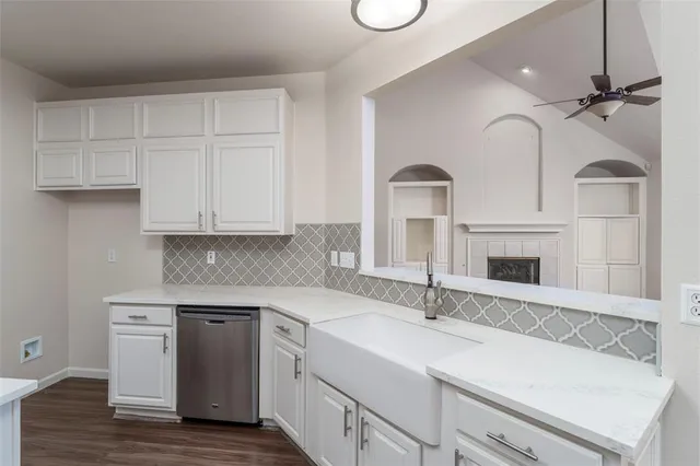 a kitchen with a sink and cabinets