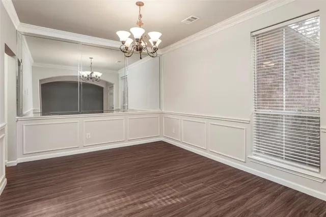 a view of a livingroom with a ceiling fan window and wooden floor