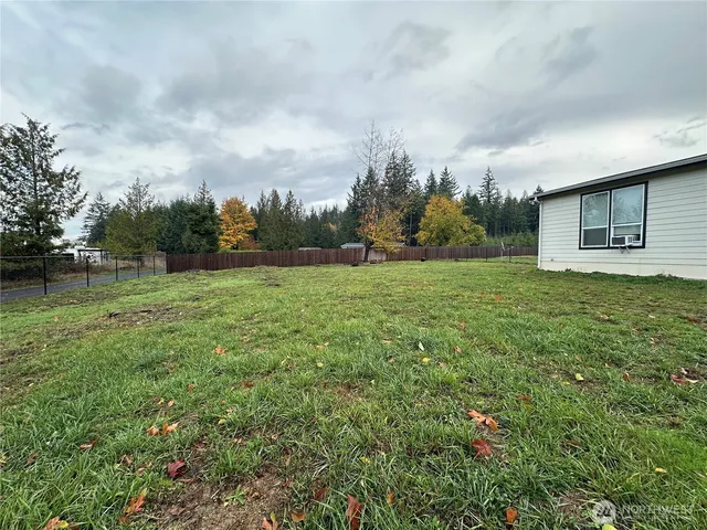 a view of a field with an ocean