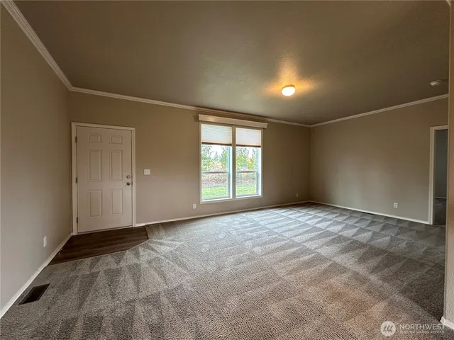 a kitchen with cabinets and stainless steel appliances