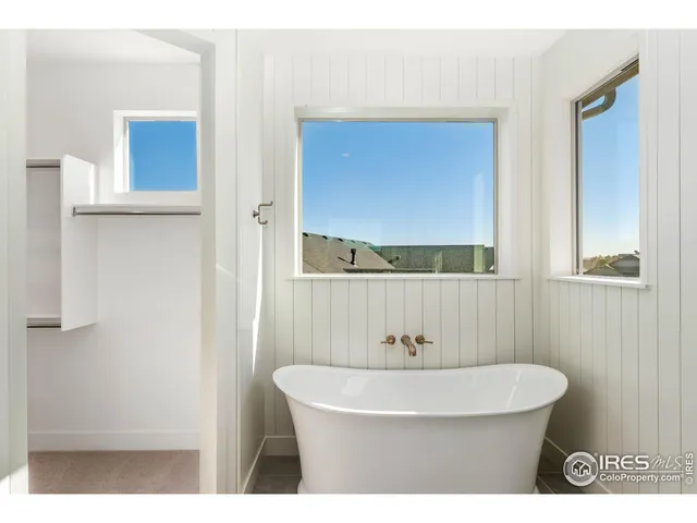 a bathroom with a toilet a sink and bathtub